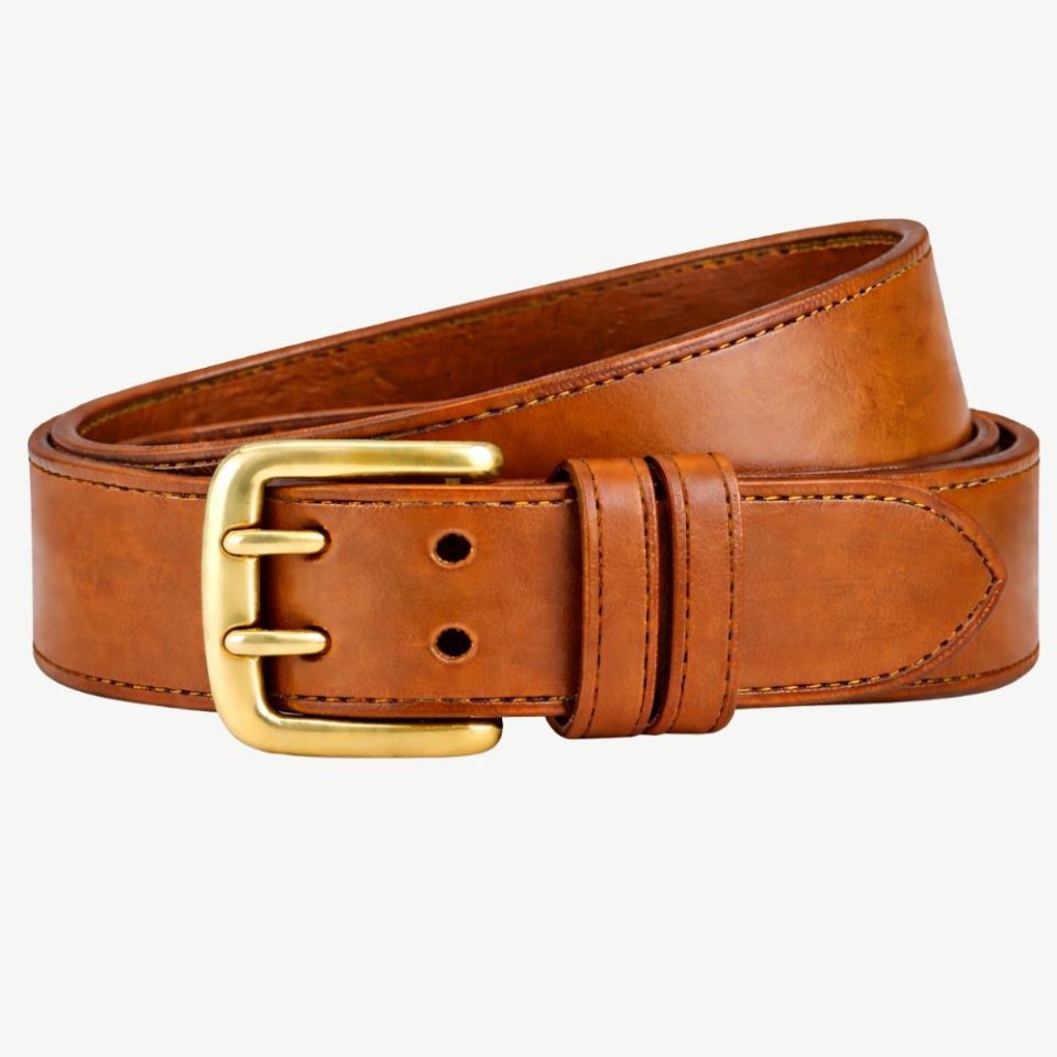 The 2 Pin Bridle Leather Belt - Tan is made from durable bridle leather, 38mm wide and over 4mm thick. Finished with a two-pin solid brass buckle and hand-stitched for quality, this belt is perfec (1)
